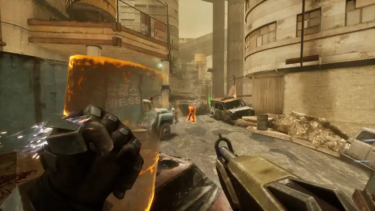 The Gravity Gloves holding a burning barrel as a shield in a dusty alley